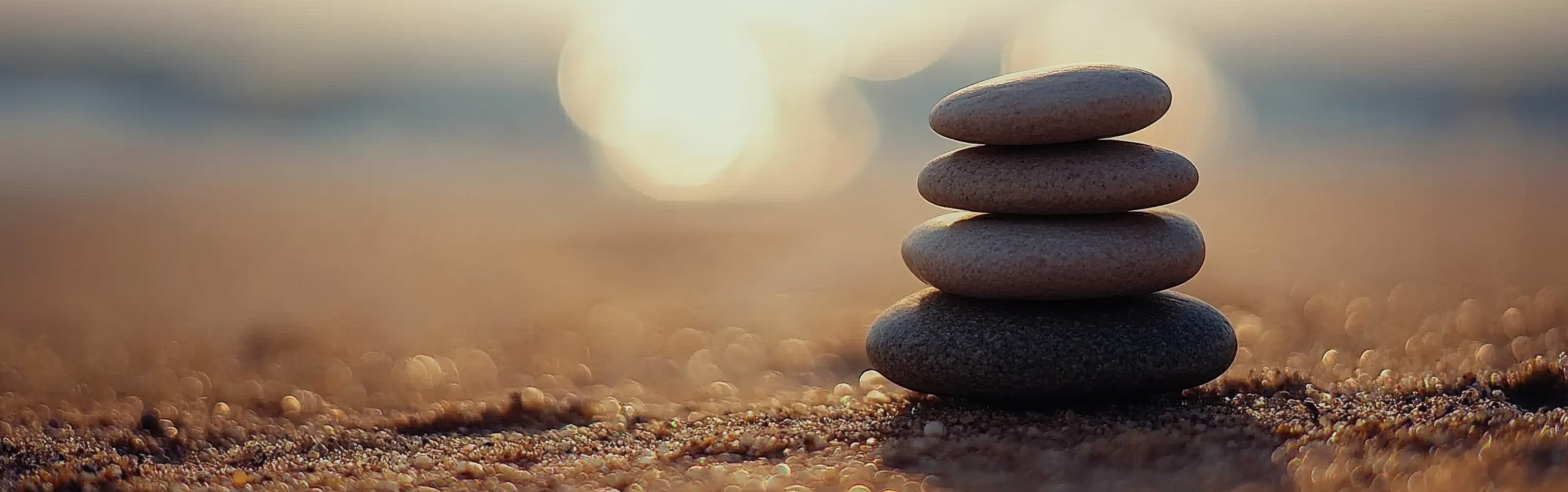 Balanced stones at sunset — measured judgment and principled leadership